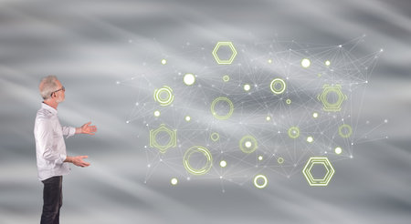 Businessman showing a digital network concept on a wall screen