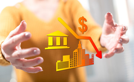 Economic crash concept between hands of a woman in background