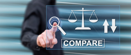 Man touching a compare concept on a touch screen with his fingerの写真素材