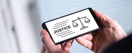 Smartphone screen displaying a justice conceptの写真素材