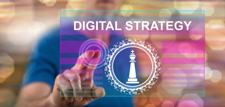 Man touching a digital strategy concept on a touch screen with his fingerの写真素材