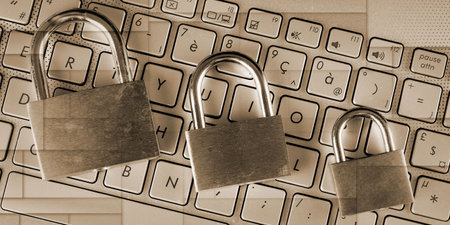 Padlocks on computer keyboard, geometric patternの写真素材