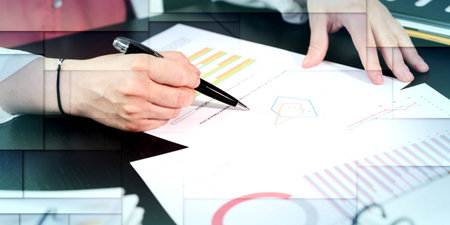 Businesswoman analyzing marketing data, geometric pattern