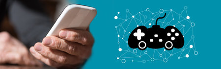Hand holding mobile phone with online gaming concept on background