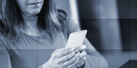 Woman holding and using her mobile phone, geometric pattern