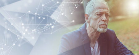 Portrait of handsome mature man, outdoors, light effect; panoramic bannerの写真素材