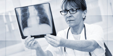 Female doctor looking at x-ray in clinic, geometric pattern