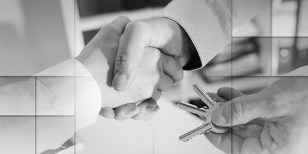 Realtor shaking hands with his client by delivering the keys, closeup, geometric pattern