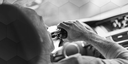 Man drinking a beer while driving, geometric patternの写真素材