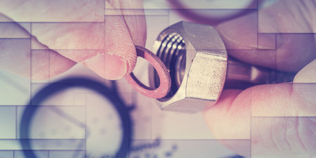 Plumber putting a gasket on a plumbing fitting, closeup, geometric pattern