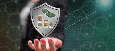 Money protection concept above the hand of a woman in background