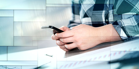 Female hands using a mobile phone, geometric pattern