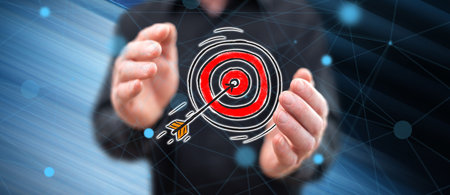 Business target concept between hands of a man in background