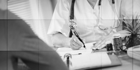 Female doctor writing prescription to her patient in medical office, geometric patternの写真素材