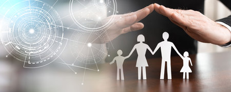 Insurer protecting a family, concept of insured family; panoramic bannerの写真素材