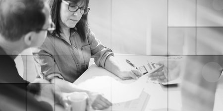 Business people working together in office, light effect, geometric patternの写真素材