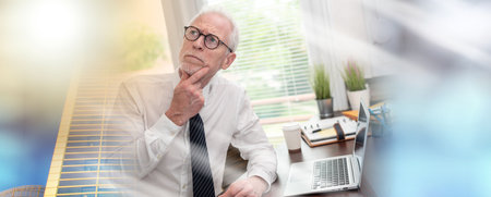 Portrait of thoughtful senior businessman at office; multiple exposureの写真素材