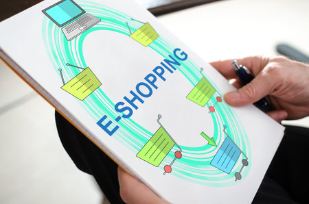 E-shopping concept on a paper held by a hand