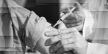 Doctor injecting vaccine to female patient, geometric patternの写真素材