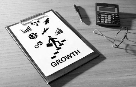 Growth concept on a clipboard with a calculator
