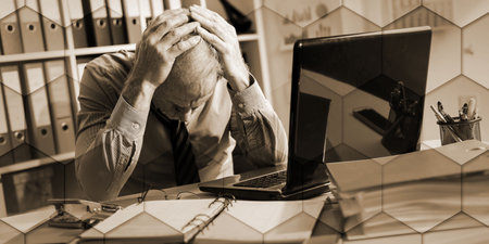 Tired businessman with headache in office, geometric pattern