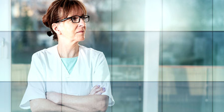 Portrait of female doctor with arms crossed, geometric pattern