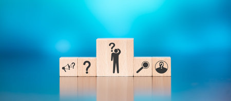Wooden blocks with symbol of question concept on blue background