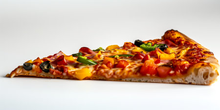 Close-up of a single slice of vegetable pizza with colorful toppings on a white backgroundの素材