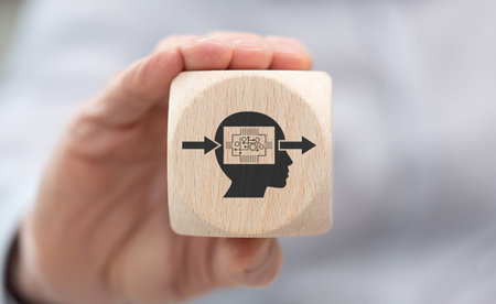 Hand holding a wooden cube with symbol of deep learning concept
