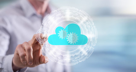 Man touching a cloud technology concept on a touch screen with his finger