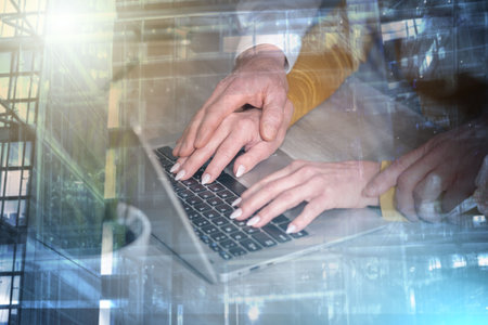 Sexual harassment at work; boss touching hand of secretary; multiple exposureの写真素材