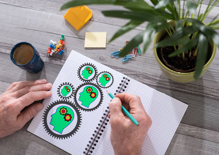 Brainstorming concept drawn on a notepad placed on a desk