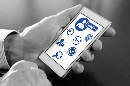 Hand holding a smartphone with login concept