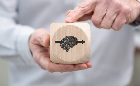 Hand holding a wooden cube with symbol of deep learning concept