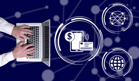 Top view of hands using laptop with symbol of e-payment concept