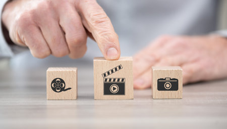 Wooden blocks with symbol of cinema concept