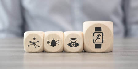 Wooden blocks with symbol of wearable technology conceptの写真素材