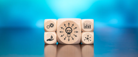 Wooden blocks with symbol of crowdfunding concept on blue backgroundの写真素材