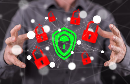 Cyber security concept between hands of a man in backgroundの写真素材