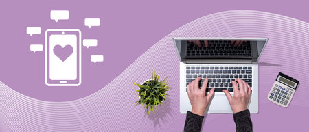 Top view of hands using laptop with symbol of social networking conceptの写真素材