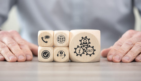 Wooden blocks with symbol of customer service conceptの写真素材