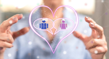 Online dating concept between hands of a woman in backgroundの写真素材