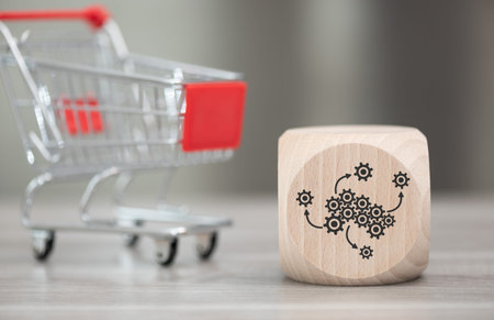 Wooden block with symbol of bpo concept and trolley on background