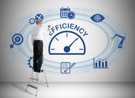 Man on a ladder drawing efficiency concept on a wallの写真素材