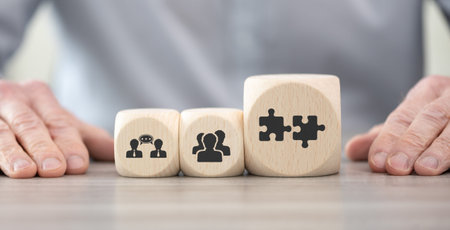 Wooden blocks with symbol of teamwork conceptの写真素材