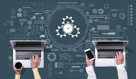 Top view of hands using laptop with symbol of productivity concept