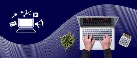 Top view of hands using laptop with symbol of online marketing conceptの写真素材