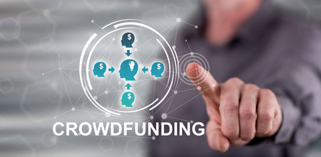 Man touching a crowdfunding concept on a touch screen with his fingerの写真素材