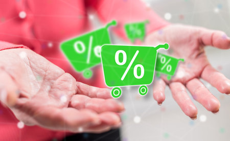 Percent discount concept above the hands of a woman in backgroundの写真素材