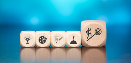 Wooden blocks with symbol of goals concept on blue backgroundの写真素材